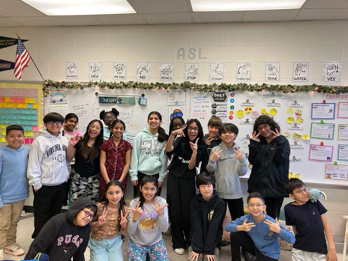 Students giving peace signs after a Second Harvest classroom visit